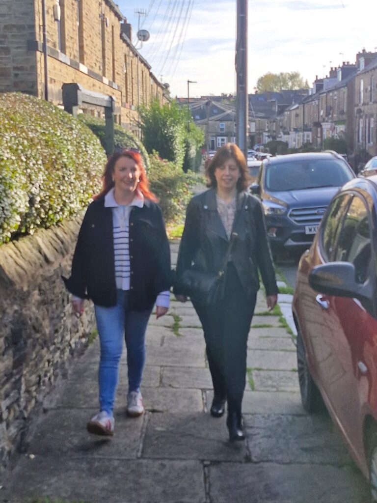 Labour deputy leadership candidate Lucy Powell walks down a street in Crookes, Sheffield alongside MP for Sheffield Heeley Louise Haigh