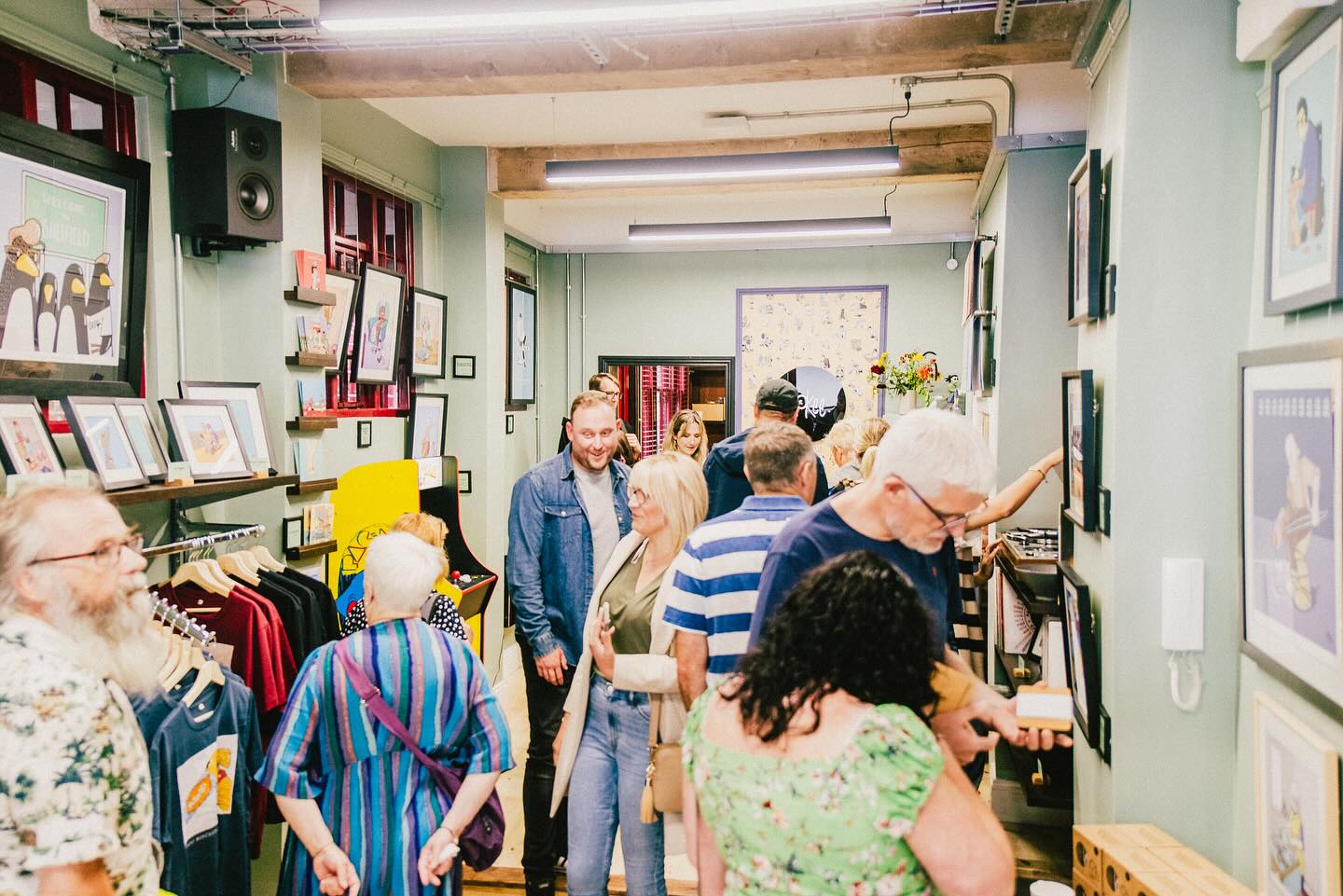 An image of a selection of people browsing the aisles of a shop