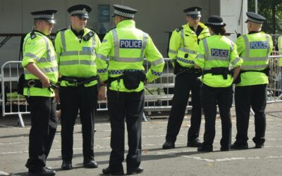 Woman arrested on suspicion of murder after a man was found dead on a driveway
