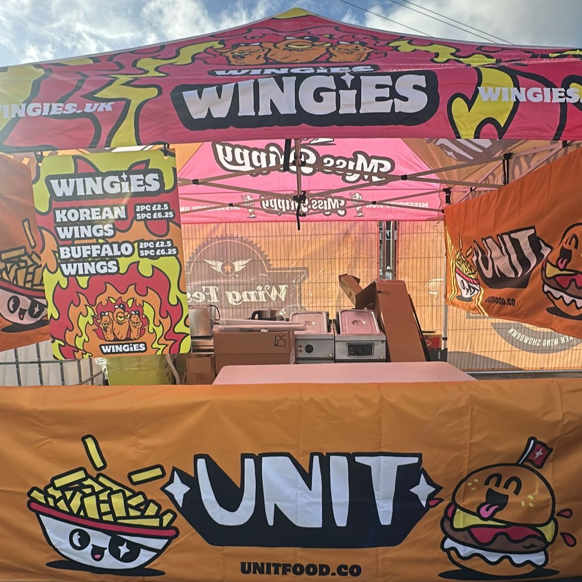 A red and orange chicken wing stand