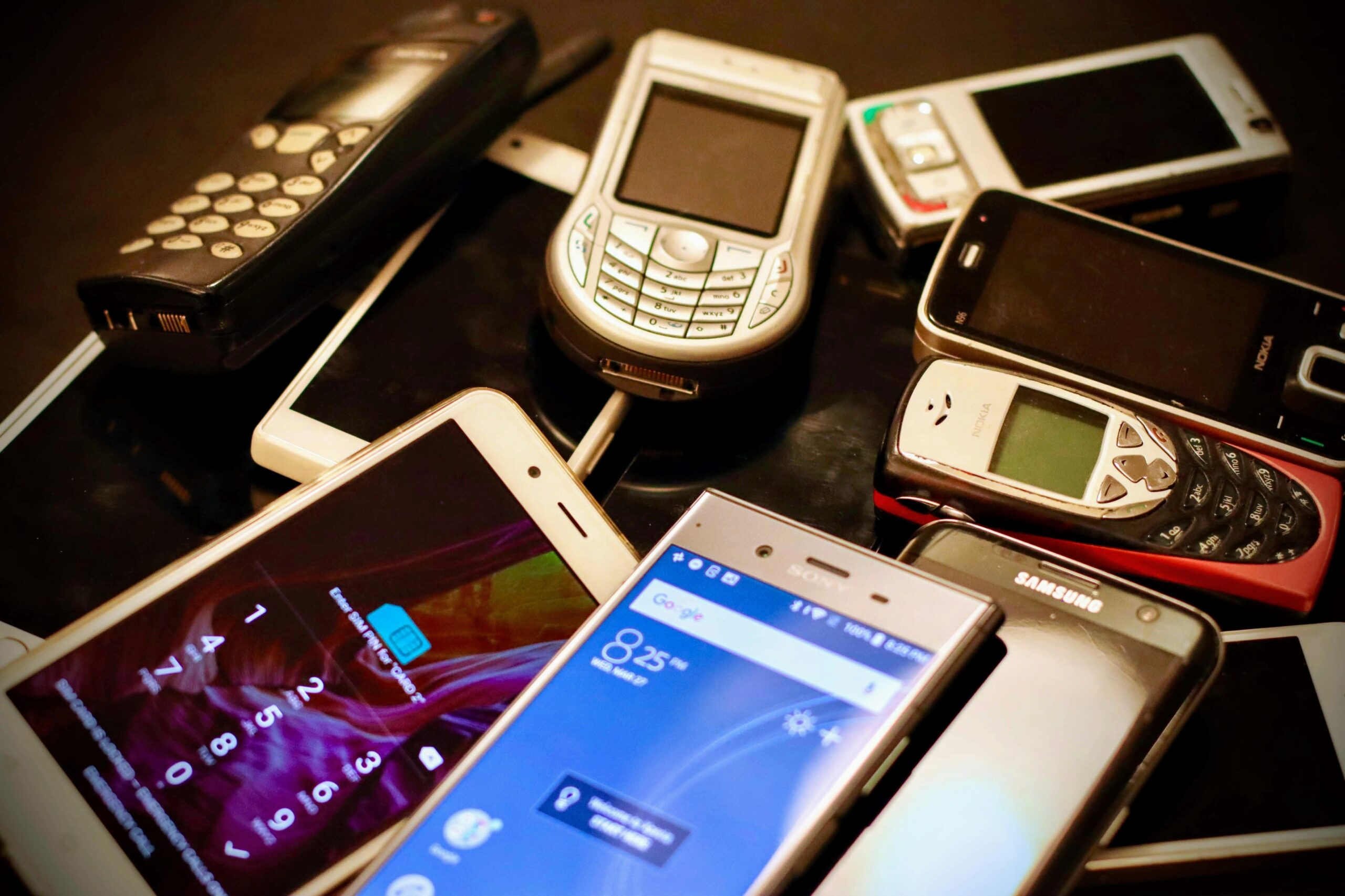 Multiple phones placed on a table