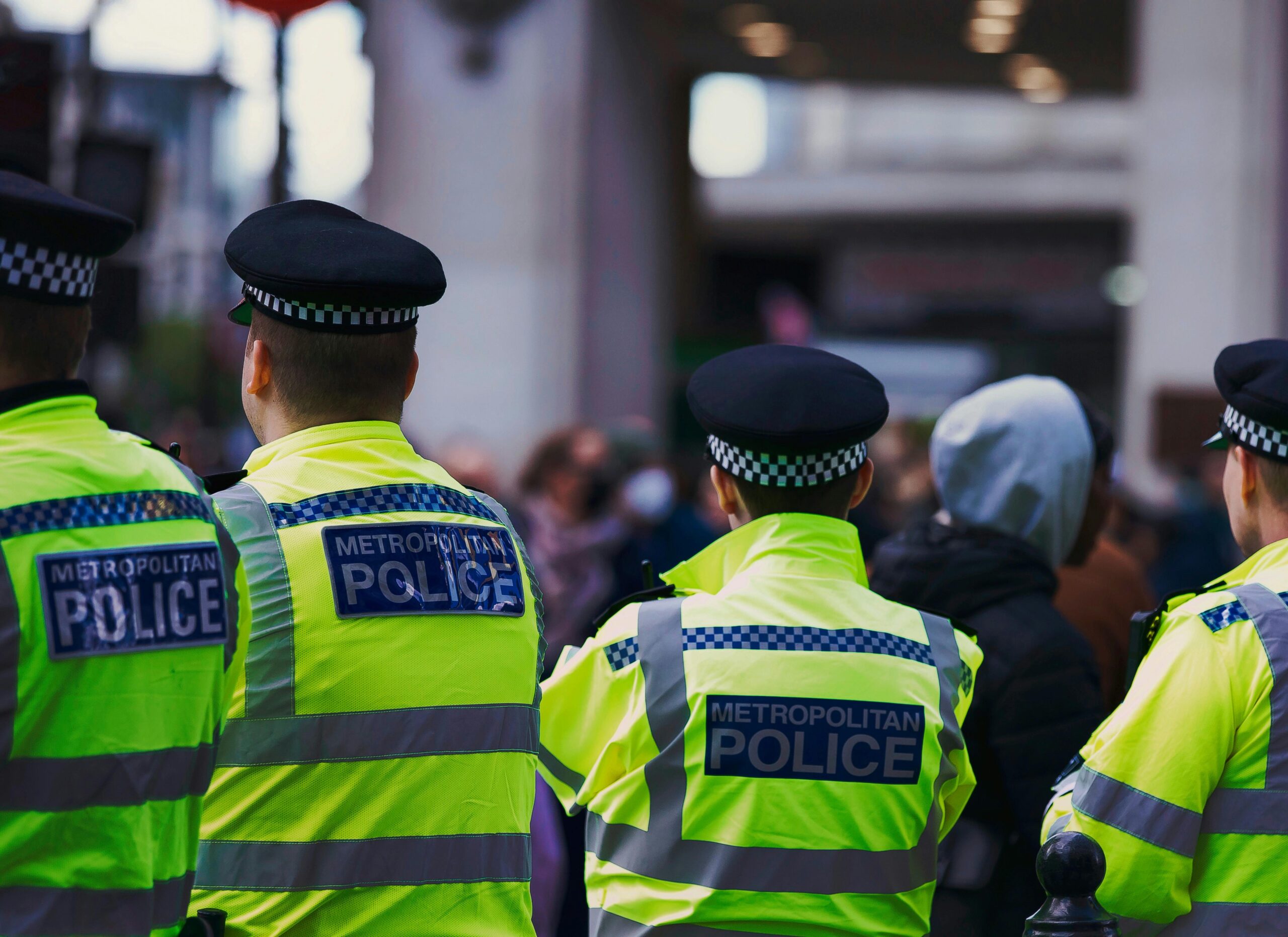 An image of the backs of police officers.