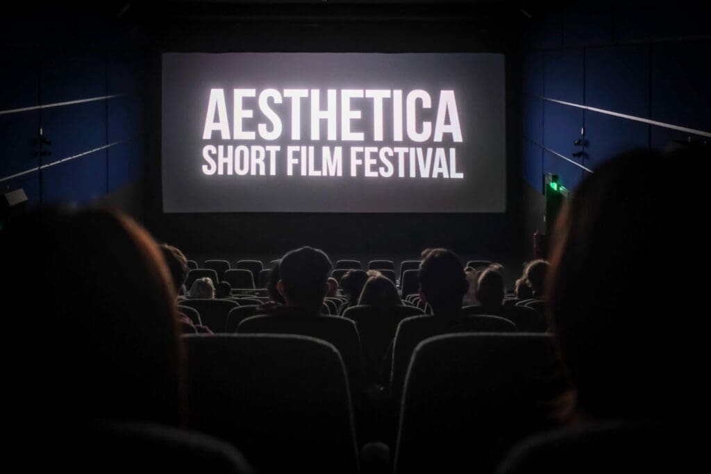 A cinema screen with Aesthetica short film festival written in white letters