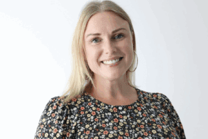 Blonde woman smiling at camera