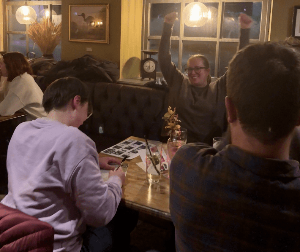 Woman with hands in the air celebrating