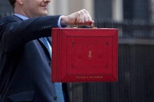 The Chancellor of the Exchequer holding the budget