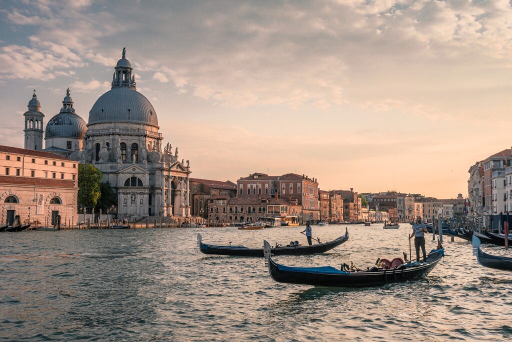 A landscape picture of Venice blending the gondolas with the houses and monuments